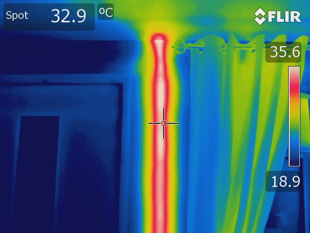Thermal image of a pipe in a wall taken using a Rainbow colour palette. 