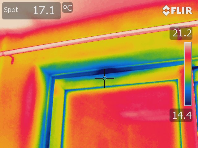 Thermal image of a window seal taken using a Rainbow colour palette. The blue around the seal indicate inadequate insulation. 