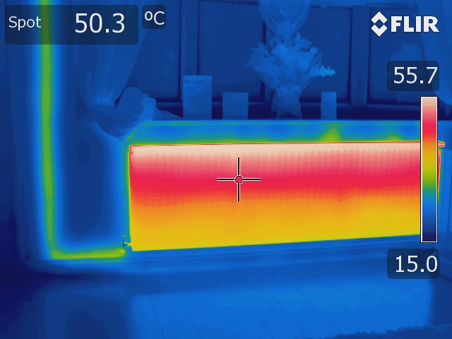 Thermal image of a radiator taken using a Rainbow Palette. The top is red and white, indicating it is hotter, and the bottom is yellow, indicating it is colder.