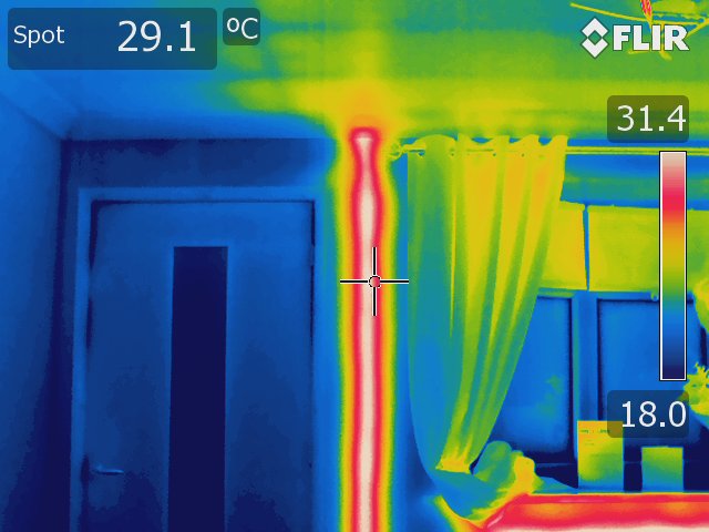 Thermal image of a pipe in a wall taken using a Rainbow colour palette. 