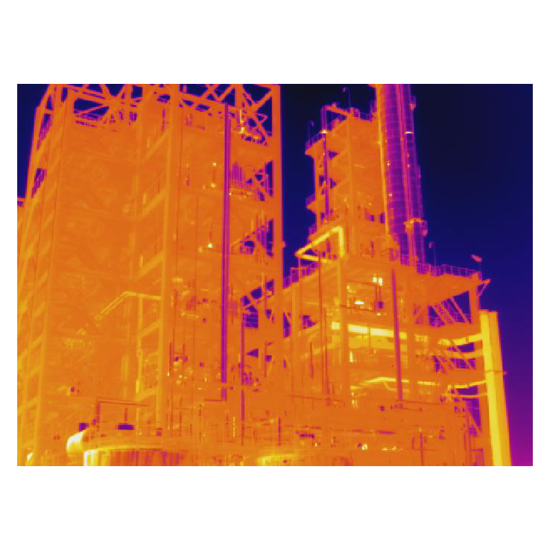 Thermal image of structures and pipes on an industrial plant.