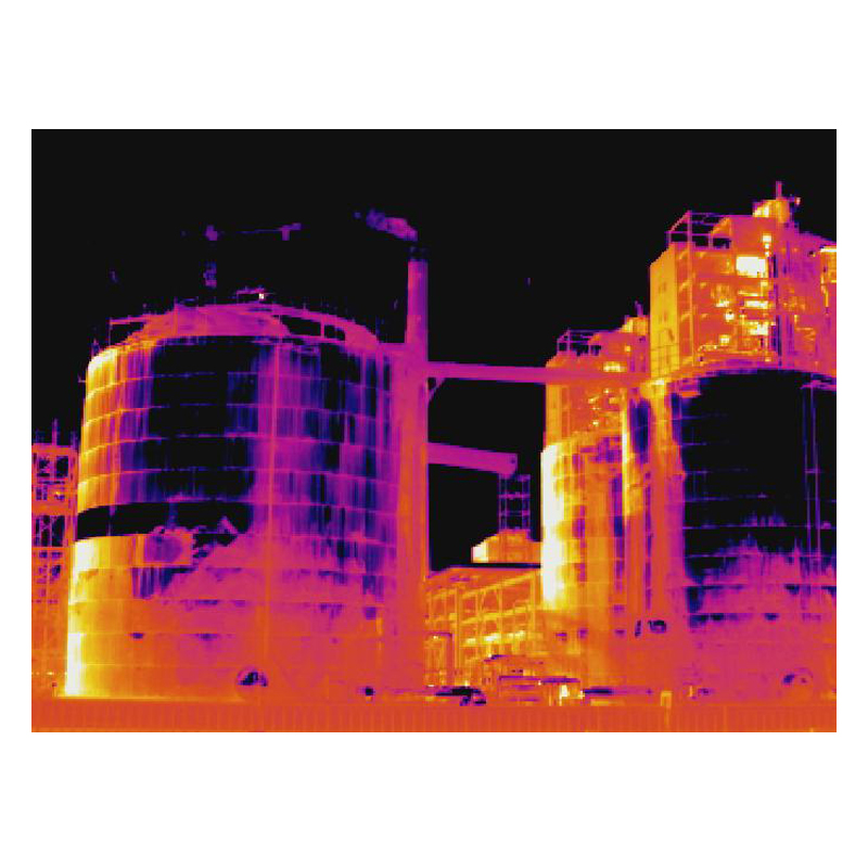 Thermal image of tankers, pipes, and structures at an industrial plant.
