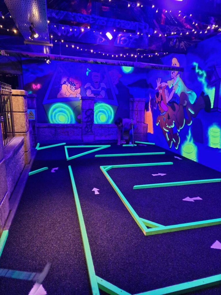 One of the glow-in-the-dark golf holes. Arrows point out the route. 