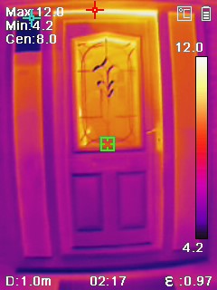 Thermal image of a front door. The top right-hand corner of the door seal is leaking heat, shown by the yellow/white colour. 