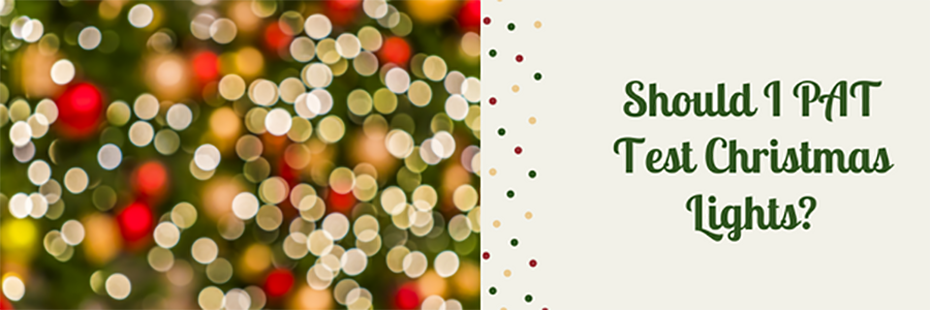 On the left is an out-of-focus close-up image of lights on a Christmas tree. On the right, large, green text on a pale grey background reads "Should I PAT Test Christmas Lights?". Three lines of small green, red and cream dots down the middle of the banner separate the photo and the text. 