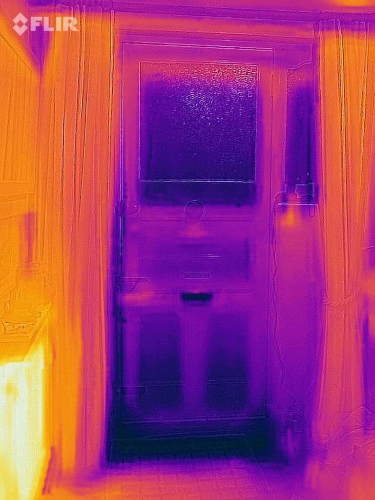 Thermal image of draughty door with the curtains open. 