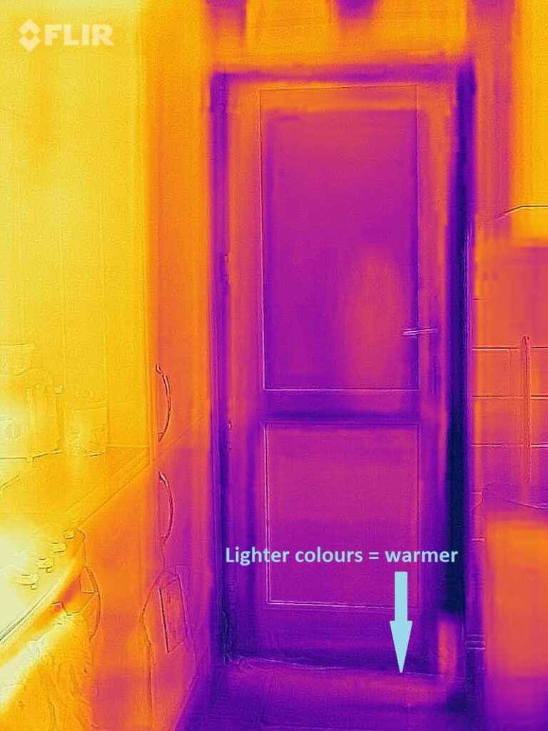 Thermal mage of a door with a draught excluder. Arrows point to the bottom and side of the door. Text above the arrows reads "Lighter colours = warmer". 