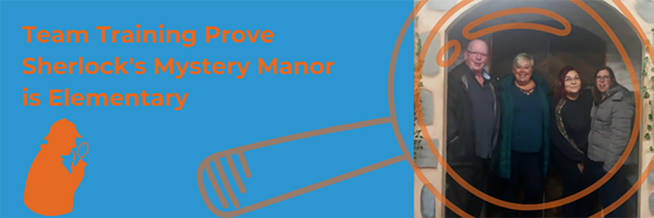 On the left of the image, large orange text on a blue background reads "Team Training Prove Sherlock's Mystery Manor is Elementary". Beneath the text is an orange silhouette of Sherlock Holmes smoking a pipe and looking through a magnifying glass. To the right of the image is a photo of Stuart, Dawn, Siobhan, and Helen smiling in the doorway of the escape room. Overlaid across the top is an outline of a large, pale orange magnifying glass. 
