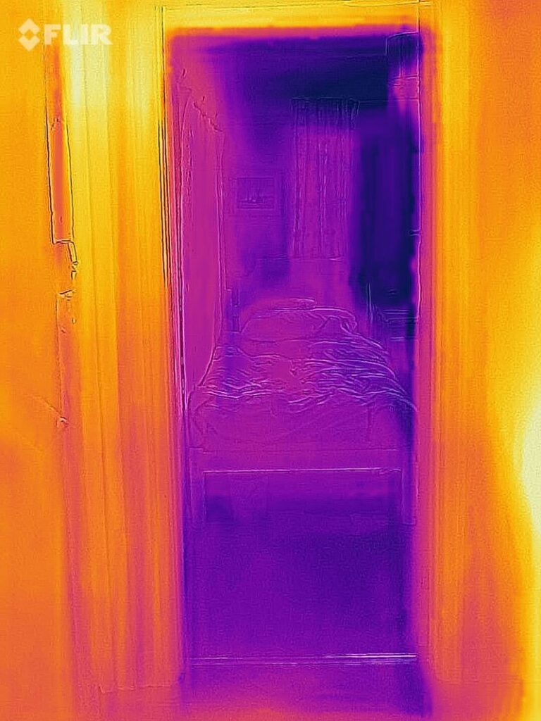 Thermal image of an unused, unheated bedroom with the door left open. 