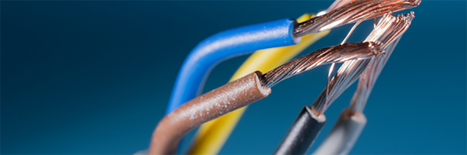 A collection of wires with the metal ends exposed on a blue background. 