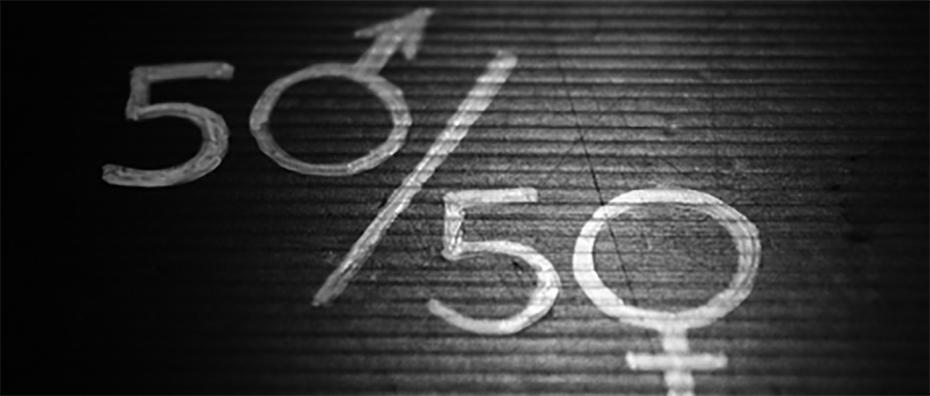 "50/50" is written in white chalk on a black background. Gender symbols are used in place of the 0 in the 50s. 
