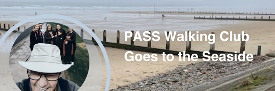 To the right of the image large white text reads "PASS Walking Club Goes to the Seaside". It sits on a photo background of a sandy beach. In the bottom right of the image is a circular photo of the Walking Club taking a selfie together on a stone pavement by the Seaside. The selfie is framed by a grey circular border. 