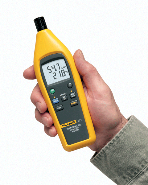Close-up of a hand holding the Fluke 971 Temperature Humidity Meter.