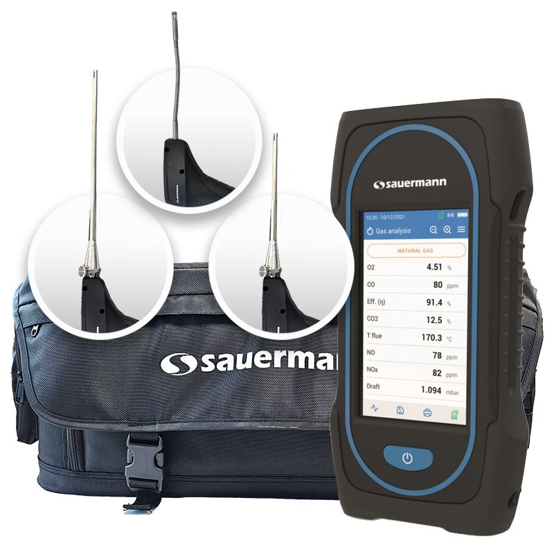 On the right stands a Sauermann Si-CA 130 Flue Gas Analyser. Behind it is a black Sauermann holdall bag. Above the bag three probe heads are displayed in circles.  