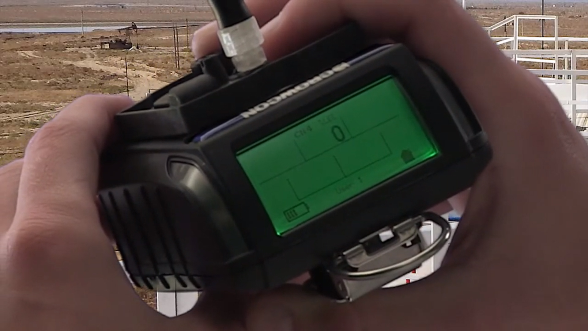 A close up of the Crowcon Gas Pro TK MED Personal Gas Detector being used in the field.