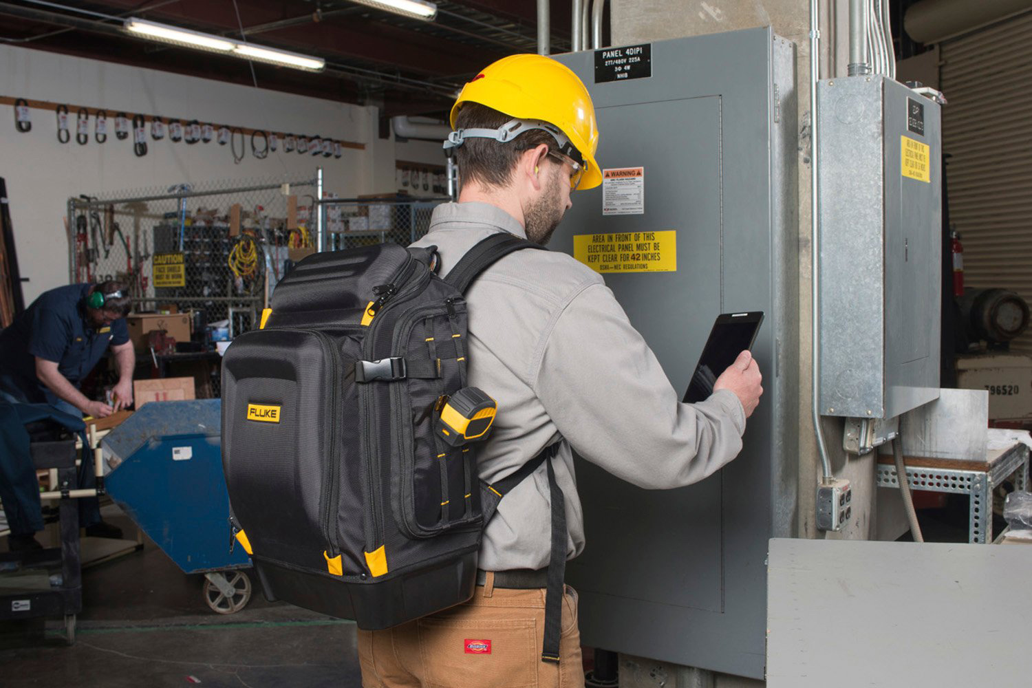 An operative is using the back to carry their instruments while performing their tasks in the workplace.