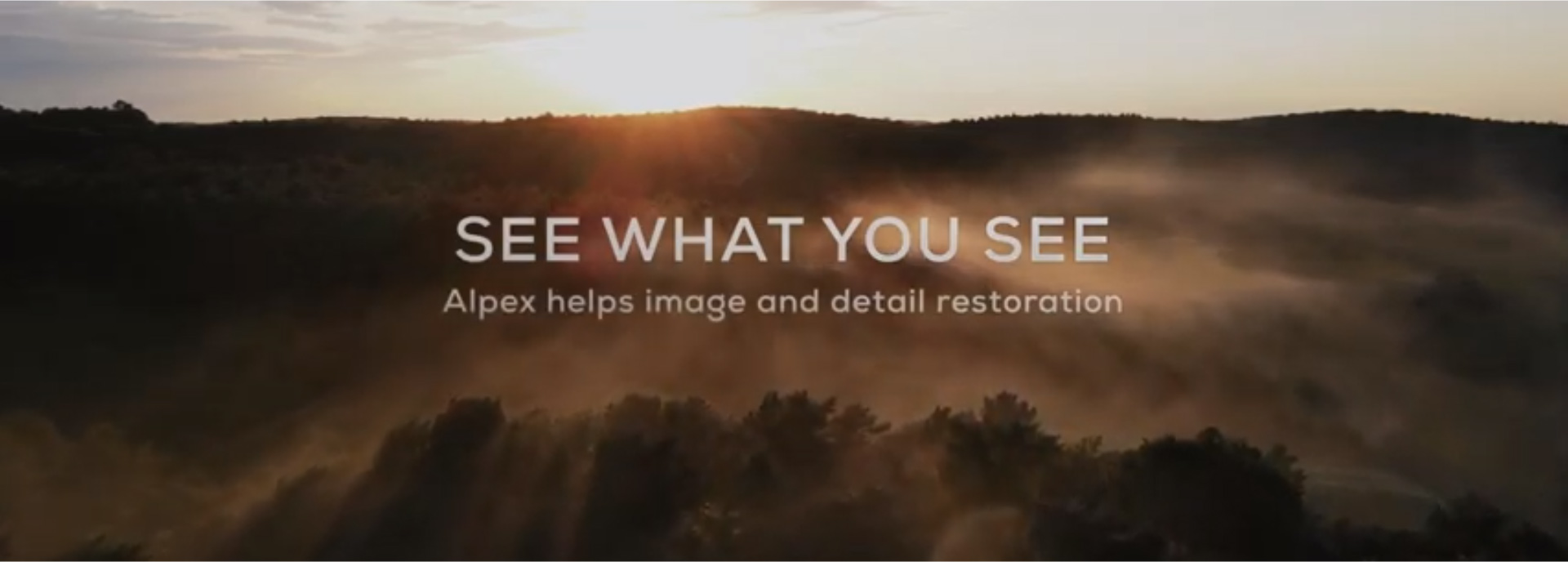 An image advertising the Hikmciro slogan 'See What You See'. The slogan is placed over a rising or setting over a forest or hilltop.