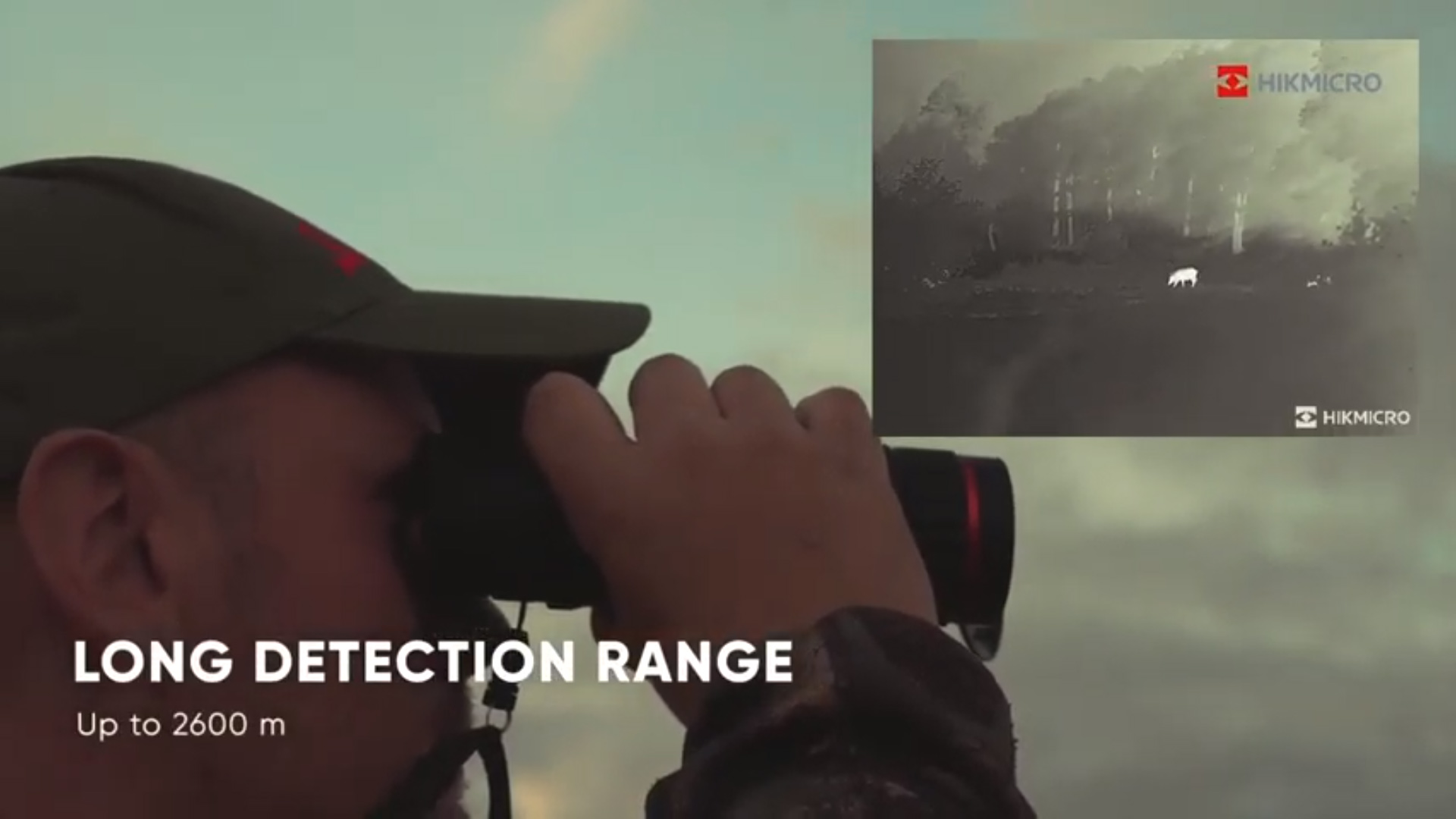 The long detection range is highlighted in this image by an operator looking throuhg the 
                  device and a picture in picture display showing the long distance view.