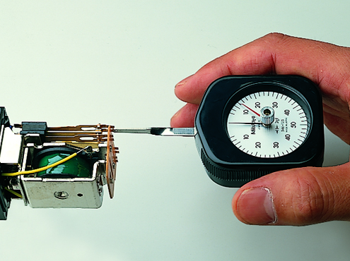 Mitutoyo Series 546 Contact Force Gauge measuring contact force on a relay.