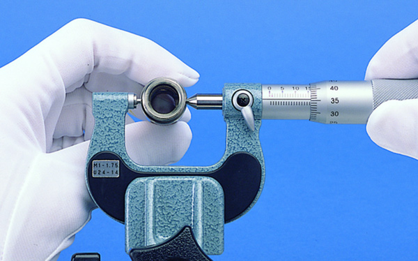 Mitutoyo Series 125 Screw Thread Micrometer in action measuring a small instrument.