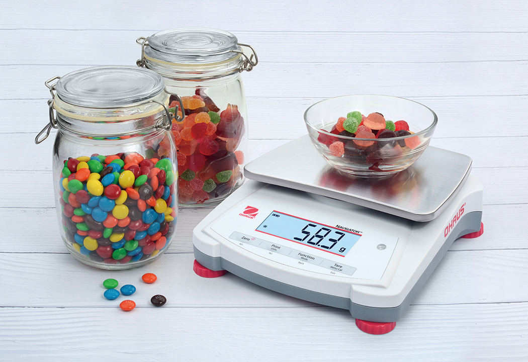Ohaus Navigator NV Precision Portable Balance weighing candy.