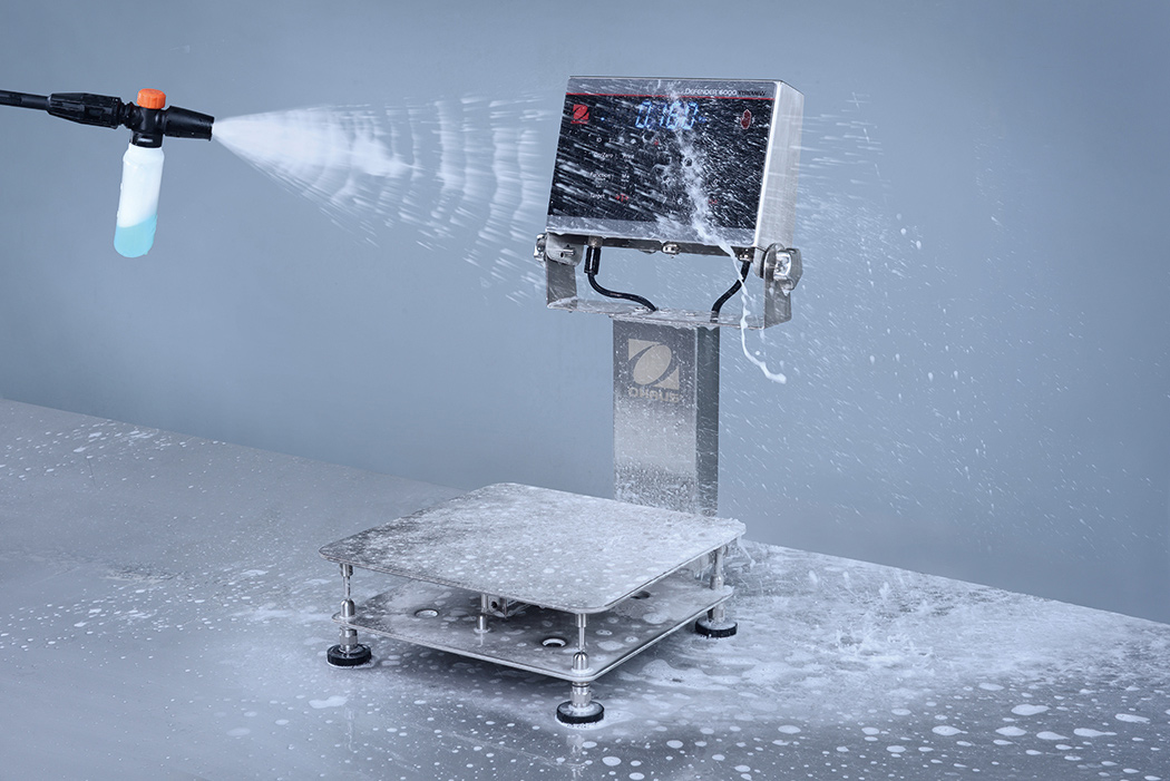 Ohaus Defender 6000 Stainless Steel IP68/IP69K Washdown i-D61XW Bench Scales getting sprayed with water.