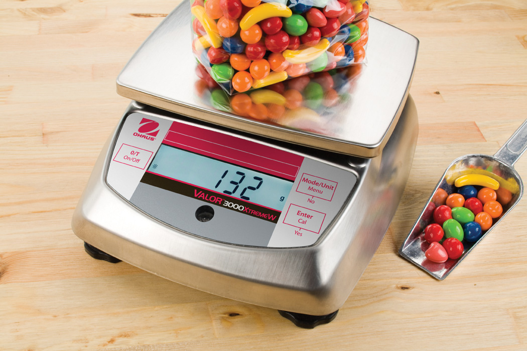 Ohaus Valor 3000 V31 Compact Precision Food Bench Scales weighing some sweets.