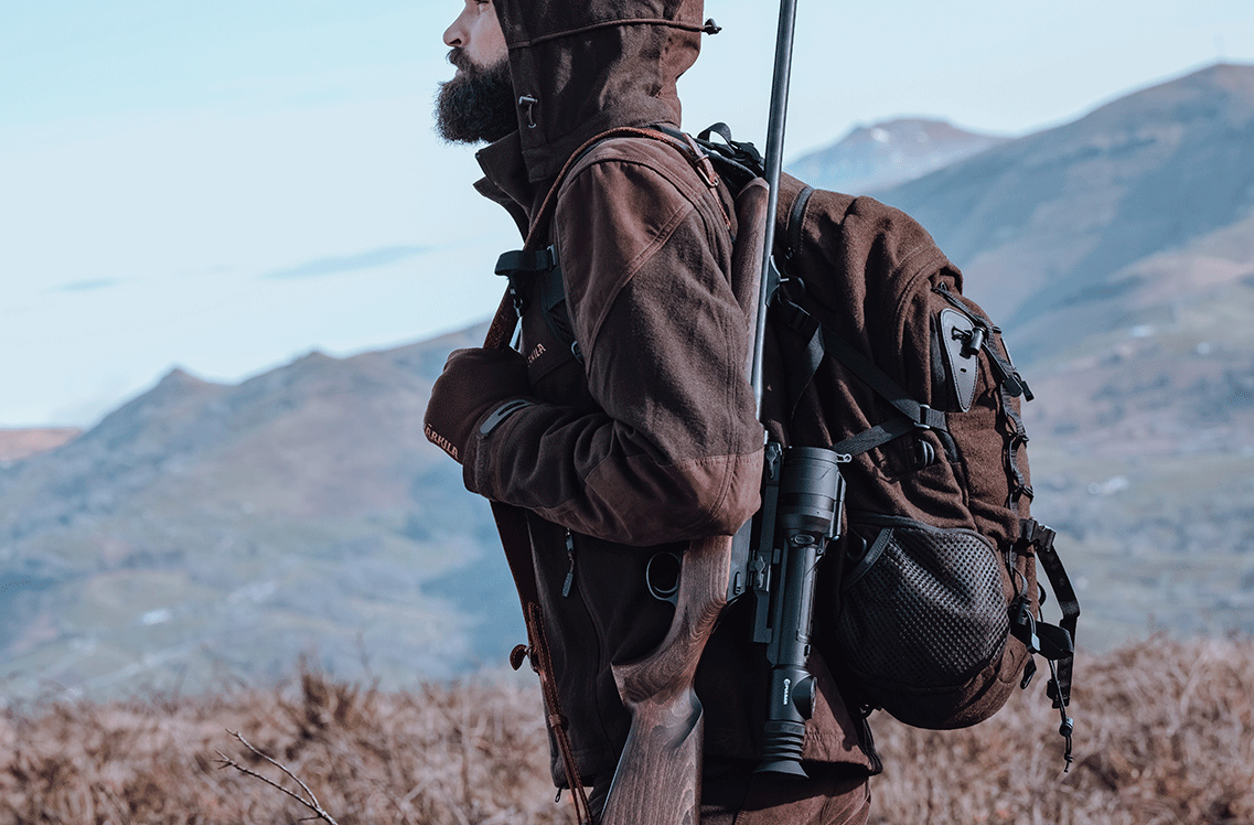 Pulsar Talion XQ35 Pro Riflescope mounted on a holstered rifle.