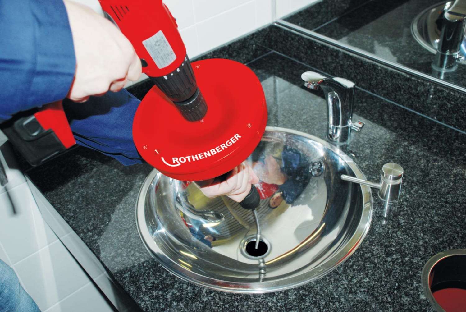 Rothenberger Rospi H&E Plus Drain Cleaner with Spiral being used in a sink on a different angle.